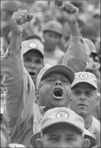  ?? The Associated Press ?? POLITICAL CRISIS: A militia members shouts slogans during a speech by Gen. Carlos Leal Telleria, Commander of the Venezuelan Bolivarian Militia Friday in Fort Tiuna, Caracas, Venezuela. President Nicolas Maduro ordered military exercises in response to...