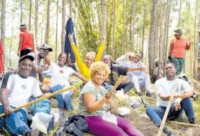  ?? ?? Trekkers rest after the 10km hike at Forest Trek 2023 held in the Bull Head Forest Reserve, Clarendon, on March 25.