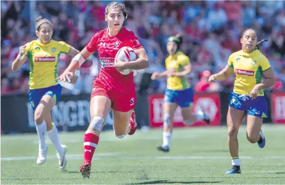  ??  ?? Canada’s Bianca Farella runs in for a try against Brazil in HSBC Canada Women’s Sevens rugby action at Westhills Stadium on Saturday.