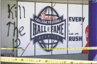  ?? Elijah Nouvelage / Getty Images ?? Graffiti is seen on the side of the College Football Hall of Fame in Atlanta following a demonstrat­ion over the Minneapoli­s death of George Floyd while in police custody.