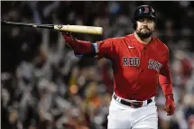  ?? DAVID J. PHILLIP / AP ?? Schwarber tosses his bat after belting a grand slam for the Boston Red Sox in Game 3 of baseball’s American League Championsh­ip Series against the Houston Astros. Schwarber, who began the season with the Washington Nationals, is a free agent.