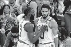  ?? Elsa/Getty Images ?? Jaylen Brown, left, and Jayson Tatum are two of the young players who have answered the critics’ questions on whether a championsh­ip-caliber team could be built around them.