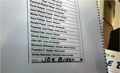  ?? STEVEN PORTER/GLOBE STAFF ?? President Biden’s name does not appear on the Democratic ballot for the N.H. presidenti­al primary. This spurred an effort to educate voters on how to write in his name on the ballot.