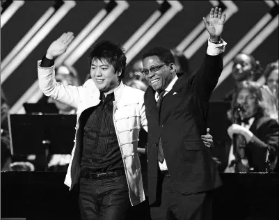  ?? PHOTOS PROVIDED TO CHINA DAILY ?? Musicians Lang Lang (left) and Herbie Hancock perform onstage during the 50th annual Grammy awards at the Staples Center in Los Angeles on Feb 10, 2008.
