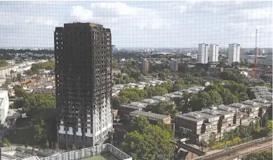  ??  ?? The remains of Grenfell Tower stand in London, Saturday, June 17, 2017. Police Commander Stuart Cundy said Saturday it will take weeks or longer to recover and identify all the dead in the public housing block that was devastated by a fire early...