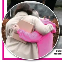  ?? ?? COMFORT: Pink-clad Sinead O’connor with mourners after the funeral of Shane yesterday