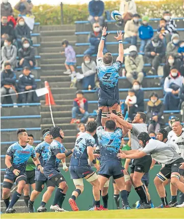  ??  ?? HIGH FLIER: Murray Douglas, below, and in action in Japan’s Top League.