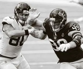  ?? Matt Patterson / Associated Press ?? The last victory for defensive end J.J. Watt, right, and the Texans came against the Jaguars on Oct. 11. It was the first win of the season and first for interim coach Romeo Crennel.