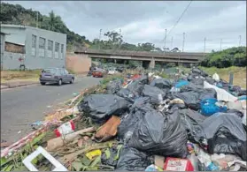  ?? Photos: Jonathan Erasmus ?? Foul-up: Rubbish piles up on Durban’s streets during the three-week strike by municipal workers, who want salaries that match those in Ekurhuleni and Tshwane metros, which brought waste management and cleaning services to a halt in the city.