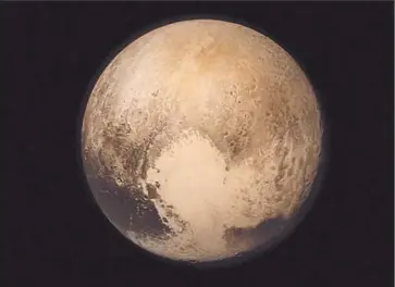  ?? NASA ?? IMAGE OF PLUTO taken by the New Horizons spacecraft, which reached it this week after a nine- year trip.