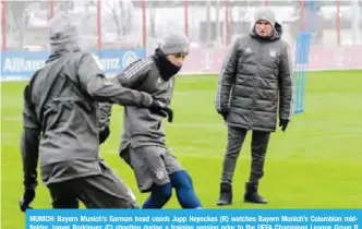  ??  ?? MUNICH: Bayern Munich’s German head coach Jupp Heynckes (R) watches Bayern Munich’s Colombian midfielder James Rodriguez (C) shooting during a training session prior to the UEFA Champions League Group B match