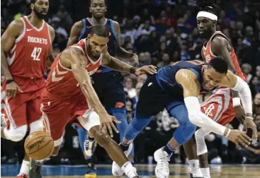  ?? J Pat Carter / Getty Images ?? A rash of recent injuries to teammates has forced forward Trevor Ariza, left, to play more minutes than his coach would like. “He gets tired chasing everybody around and having to score,” Mike D’Antoni said.