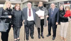  ??  ?? Waiting game Councillor Coyle joined Uta (centre, right) and other parents in handing Uta’s petition over in late 2016