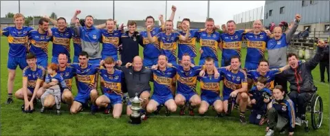  ??  ?? The jubilant Gusserane squad with manager Michael Hennessy (front row, extreme right).