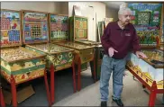  ?? JACQUELINE DORMER/REPUBLICAN HERALD VIA AP ?? Butch Glauda, of Pottsville, Pa., talks about his bingo pinball machine collection in Pottsville, Pa., on November 11. Glauda and his son Mike Glauda have plans to open a museum in Pottsville with the machines.