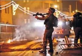  ?? Oded Balilty Associated Press ?? MORE Israeli police were deployed in Jerusalem after violence Friday left 18 officers injured. Palestinia­n medics said more than 200 Palestinia­ns were wounded.