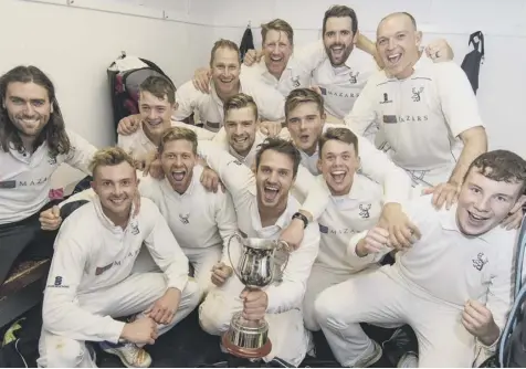  ??  ?? 0 Grange players celebrate after their Grand Final victory and now have their sights set on securing a treble with a Scottish Cup win.