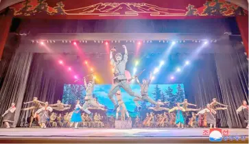  ?? STR/KCNA VIA KNS/AGENCE FRANCE-PRESSE ?? STAFF of the Ministry of Defense perform on stage to mark the 92nd anniversar­y of the founding of North Korea’s army, at a theater in Pyongyang.