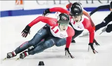  ?? JEFF McINTOSH/THE CANADIAN PRESS ?? Charle Cournoyer, left, skates to 1,000-metre gold with Samuel Girard close behind Sunday in Calgary.