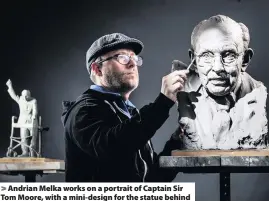  ?? Picture: Danny Lawson ?? > Andrian Melka works on a portrait of Captain Sir Tom Moore, with a mini-design for the statue behind