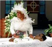  ??  ?? Tomika Miller weeps over her husband Rayshard Brooks as his coffin is closed at the conclusion of his public viewing at Ebenezer Baptist Church in Atlanta on Monday.