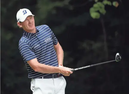  ??  ?? Brandt Snedeker tees off on the second hole during the final round of the Wyndham Championsh­ip on Sunday at Sedgefield Country Club in Greensboro, N.C. Snedeker won the event by three strokes. ROB KINNAN/USA TODAY