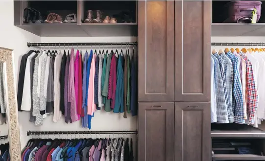  ?? STACY ZARIN GOLDBERG/CASE DESIGN ?? As you plan out a walk-in closet, consider the size of the items you’ll be hanging. This closet, designed by Case Design interior designer specialist Elena Eskandari, has two levels of hanging space which offers room for a large collection of shirts and blouses. Try to decide on an organizing system that you know you will be able to stick with.