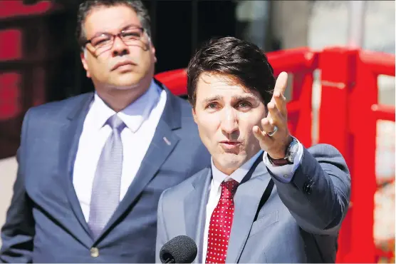  ?? DARREN MAKOWICHUK ?? Prime Minister Justin Trudeau with Calgary Mayor Naheed Nenshi announce federal funding for the new Green Line in Calgary on Tuesday.