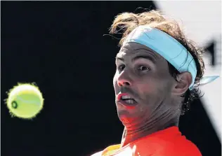  ?? PHOTO: REUTERS ?? Spain's Rafael Nadal in action during his Australian Open first round match against Serbia's Laslo Djere at Rod Laver Arena in Melbourne yesterday.