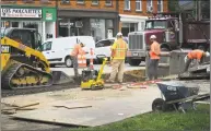  ?? Erik Trautmann / Hearst Connecticu­t Media ?? Workers with Middlesex Constructi­on continue drainage work at Liberty Square on Wednesday.