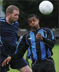  ??  ?? Gerry McCann of NPL gets to the ball ahead of South End’s Dolapo Omatayo.