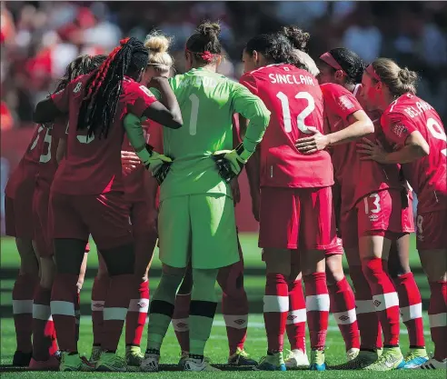  ?? — THE CANADIAN PRESS FILES ?? Canada captain Christine Sinclair huddles with teammates during the 2015 FIFA Women’s World Cup in Vancouver. The squad, led by Sinclair, is in Spain training for this summer’s iteration of the tournament.