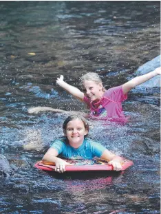  ?? Picture: BRENDAN RADKE
Starting from the Crystal Cascades carpark, walk up the concrete path past the second picnic area and you will see a sign on you left to walk up the hill.
If you take on the walk as a return trek, start and finish at Crystal Casca ?? SPLASH DOWN: Chloe Harley and Kira Applebee cooling off at Crystal Cascades.