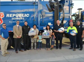  ??  ?? Calexico residents Josefina bravo (middle left) and leticia Noriega expressed gratitude on Tuesday after being presented with Thanksgivi­ng turkeys and gift baskets by city officials and Republic Services representa­tives at City hall. JULIO MORALES PHOTO