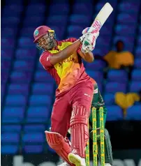  ?? AFP ?? Andre Russell of West Indies hits a six during the opening T20 match against Bangladesh. Russell was later named the Man of the Match for his knock of 35 runs off 21 ball. —