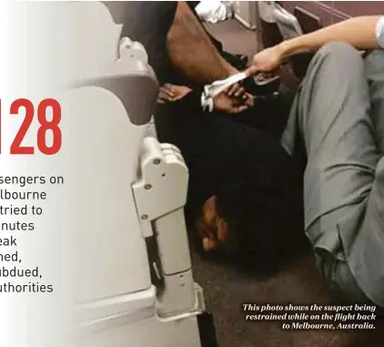  ??  ?? This photo shows the suspect being restrained while on the flight back
to Melbourne, Australia.