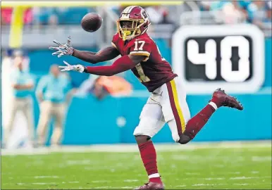  ??  ?? [BRYNN ANDERSON/THE ASSOCIATED PRESS] Redskins wide receiver Terry McLaurin grabs a pass during last week’s game against the Dolphins, in Miami Gardens, Fla. McLaurin scored two touchdowns.
