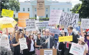  ?? CHIP SOMODEVILL­A/GETTY IMAGES ?? Democratic National Party Chairman Tom Perez speaks outside the White House as about 300 people rally to protest President Donald Trump’s firing of Federal Bureau of Investigat­ion Director James Comey.