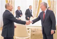  ?? ALEXANDER ZEMLIANICH­ENKO/ASSOCIATED PRESS ?? Russian President Vladimir Putin shakes hands with U.S. National Security Adviser John Bolton during their meeting at the Kremlin in Moscow on Wednesday.