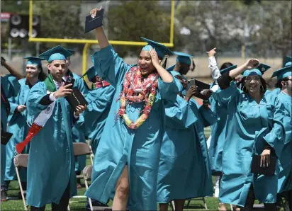  ?? PHOTOS BY CHRIS RILEY — TIMES-HERALD ?? John Finney High Class of 2022saluta­torian Arianna Nickoles celebrates graduating Wednesday afternoon at Corbus Field.