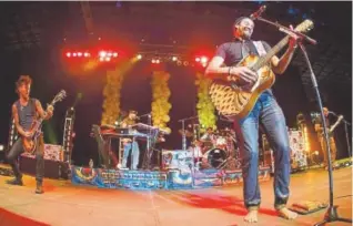  ?? Steve Peterson, Special to The Denver Post ?? Left, Michael Franti & Spearhead, here at the 2014 Nightshine Gala fundraiser in Denver, will be at Red Rocks in June.