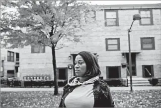  ?? ARMANDO L. SANCHEZ/CHICAGO TRIBUNE ?? Courtney Springfiel­d, 35, stands near where 9-year-old Janari Ricks was fatally shot at the Cabrini-Green rowhouses. Janari was playing with Courtney’s son when he was killed.