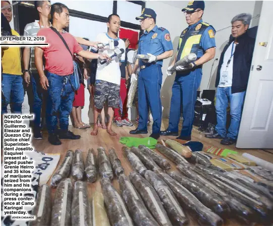  ??  ?? NCRPO chief Director Guillermo Eleazar and Quezon City police chief Superinten­dent Joselito Esquivel present alleged pusher Grenie Heirro and 35 kilos of marijuana seized from him and his companions during a press conference at Camp Karingal yesterday. JOVEN CAGANDE