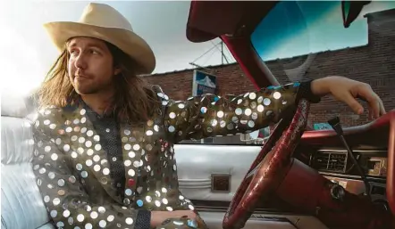  ?? Curtis Wayne Millard ?? “You can make something beautiful out of nothing,” Aaron Lee Tasjan says of his sequined suit. It’s also his approach to songwritin­g.