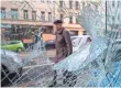  ?? GETTY IMAGES ?? A man walks past the shattered windows of a launderett­e in Leipzig, Germany, on Tuesday, the day after rightwing supporters rioted.