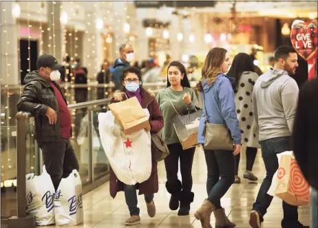  ?? Brian A. Pounds / Hearst Connecticu­t Media ?? Black Friday shoppers take advantage of steep sale prices at many stores at the Connecticu­t Post Mall in Milford on Nov. 26.