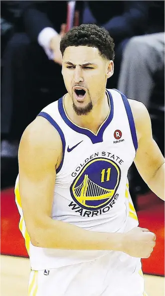  ?? BOB LEVEY/GETTY IMAGES ?? Klay Thompson is just one of three elite scorers on the Golden State Warriors, who also boast a much more talented supporting cast than the one surroundin­g LeBron James in Cleveland.