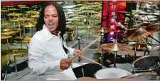  ?? JULIA MALAKIE, FILE/AP PHOTO ?? Drummer Terri Lyne Carrington plays a set of drums with Zildjian cymbals, in a room of Zildjian cymbals, in 2003 during the 380th anniversar­y of the famous cymbal maker in Norwell, Mass.