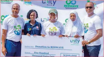  ?? ?? LR: Head, Corporate Communicat­ions, Unity Bank Plc, Mr. Matthew Obiazikwor; Member, Recycling Scheme for Women and Youth Empowermen­t (RESWAYE), Mrs. Omotola Johnson; Founder, RESWAYE, Doyinsola Ogunye; Member, RESWAYE, Silifat Jimoh; and Group Head, Risk Management, Unity Bank Plc. Mr. Chris Nwambu presenting a cheque of N500, 000 to RESWAYE from Unity Bank during a cleaning exercise at Elegushi Kids Beach Garden held in commemorat­ion of World Earth Day, 2022. In Lagos… recently