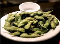  ?? Democrat-Gazette file photo ?? Edamame is served in the pod or shelled, and tend to be eaten cold or steamed. The only large-scale edamame processing plant in the U.S. is in Mulberry.